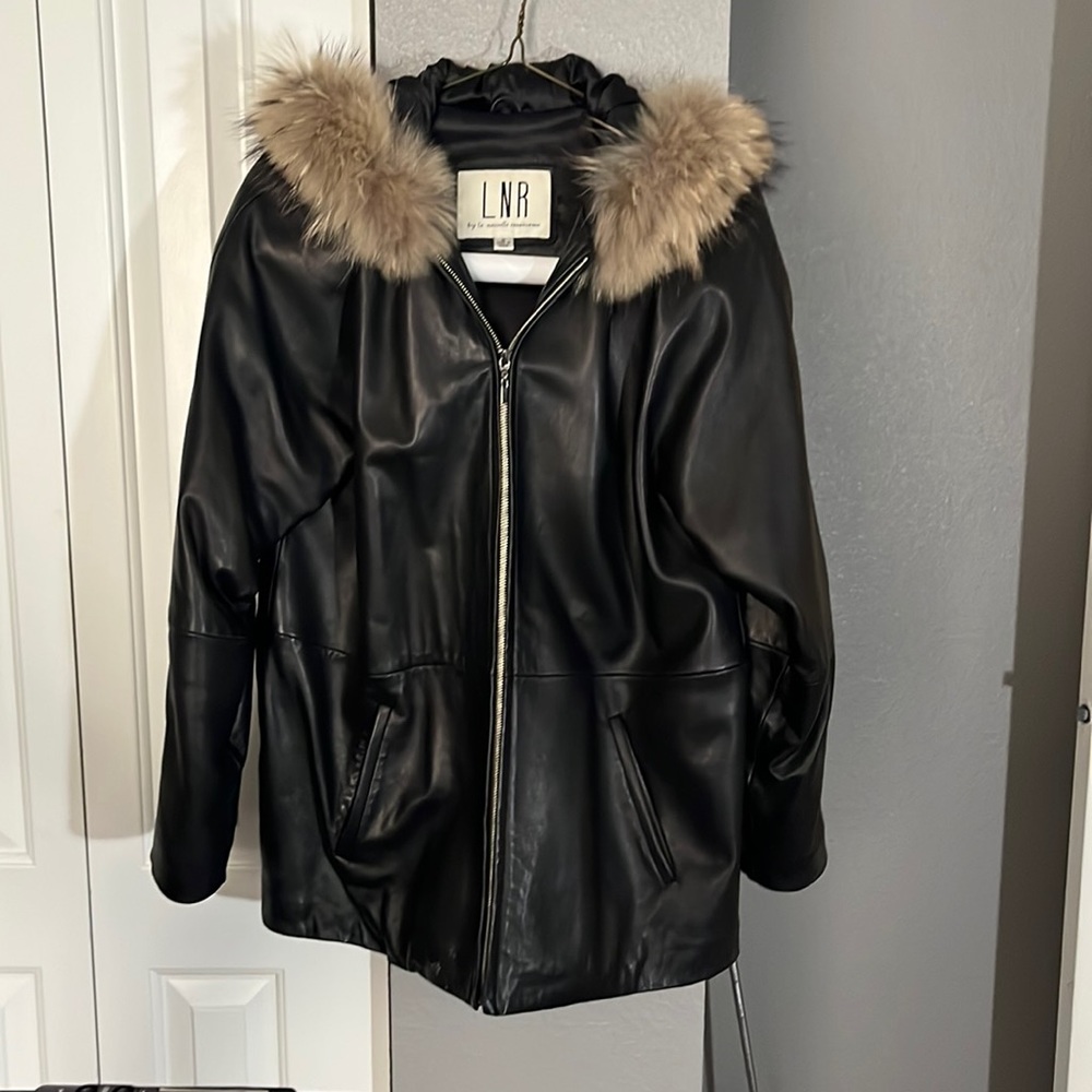 Black leather coat with raccoon fur hood